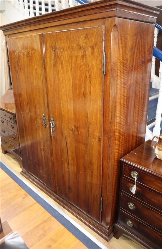 A 19th century German walnut armoire W.148cm